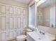 Bathroom with built-in cabinets and updated vanity at 518 Riverside Dr, Tarpon Springs, FL 34689