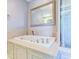 Elegant bathroom with a large soaking tub and walk-in shower at 518 Riverside Dr, Tarpon Springs, FL 34689
