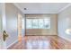 Bright bedroom with hardwood floors and large windows at 518 Riverside Dr, Tarpon Springs, FL 34689