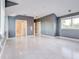 Large bedroom with gray walls and whitewashed floors at 518 Riverside Dr, Tarpon Springs, FL 34689