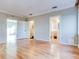 Spacious bedroom with hardwood floors and access to bathroom at 518 Riverside Dr, Tarpon Springs, FL 34689