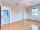 Hardwood floor bedroom with access to other rooms at 518 Riverside Dr, Tarpon Springs, FL 34689