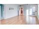Breakfast room with hardwood floors, exposed brick wall and door to outside at 518 Riverside Dr, Tarpon Springs, FL 34689