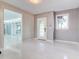Bright entryway with white floors and a view into another room at 518 Riverside Dr, Tarpon Springs, FL 34689