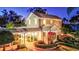Grand home with covered entryway and lush landscaping at 518 Riverside Dr, Tarpon Springs, FL 34689