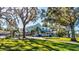 Stunning two-story home with a spacious lawn and mature trees at 518 Riverside Dr, Tarpon Springs, FL 34689