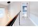 Upper hallway with whitewashed floors and access to bedroom at 518 Riverside Dr, Tarpon Springs, FL 34689