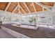 Indoor spa with a wood-paneled ceiling and large windows at 518 Riverside Dr, Tarpon Springs, FL 34689