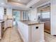 Kitchen with white cabinets, granite counters, and stainless steel appliances at 518 Riverside Dr, Tarpon Springs, FL 34689