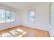 Bright office with hardwood floors and built-in shelves at 518 Riverside Dr, Tarpon Springs, FL 34689