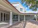 Large brick patio with a covered area and columns at 518 Riverside Dr, Tarpon Springs, FL 34689