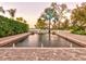 Inviting rectangular pool with brick pavers and fountain features at 518 Riverside Dr, Tarpon Springs, FL 34689