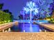 Inviting lighted pool with spacious patio area at 518 Riverside Dr, Tarpon Springs, FL 34689