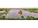 Aerial view of waterfront property with a private dock at 518 Riverside Dr, Tarpon Springs, FL 34689