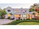 Charming two-story home featuring a covered porch, landscaped yard, and inviting curb appeal at 518 Riverside Dr, Tarpon Springs, FL 34689