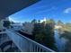 Balcony view overlooking a tranquil waterway, lush foliage, and resort amenities at 5500 Gulf Blvd # 2235, St Pete Beach, FL 33706