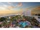 Aerial view of resort at sunset, showing beach and pool area at 5500 Gulf Blvd # 2235, St Pete Beach, FL 33706