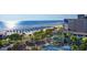Aerial view of resort, beach, and pool with ocean view at 5500 Gulf Blvd # 2235, St Pete Beach, FL 33706