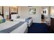Bedroom with two double beds, updated decor, and access to another room at 5500 Gulf Blvd # 2235, St Pete Beach, FL 33706