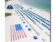 Beachfront property with beach chairs and large inflatable slide at 5500 Gulf Blvd # 2237, St Pete Beach, FL 33706