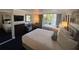 Two double beds, sitting area, and view of balcony at 5500 Gulf Blvd # 2237, St Pete Beach, FL 33706