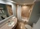 Bathroom with tub, shower, and granite countertop at 5500 Gulf Blvd # 2237, St Pete Beach, FL 33706