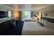 Guest bedroom with two double beds, balcony access, and sitting area at 5500 Gulf Blvd # 2237, St Pete Beach, FL 33706