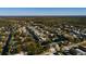 An aerial view of the house from above showcasing neighborhood and tree coverage at 7176 Westwind St, Weeki Wachee, FL 34607