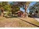 Charming single-story home featuring a cozy front porch and a spacious front yard with mature trees at 7176 Westwind St, Weeki Wachee, FL 34607