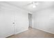 Empty bedroom featuring tiled flooring, closet, and ceiling fan at 8255 Greenleaf Cir, Tampa, FL 33615