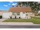 Single story home with attached garage and well-manicured lawn at 8370 Burgundy N Dr # 8370, Pinellas Park, FL 33781