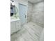 Spa-like bathroom with walk-in shower and pebble floor at 9126 Bush Cir, Spring Hill, FL 34606