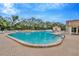 Inviting community pool with brick patio and lounge chairs at 11390 Deercroft Ct, Spring Hill, FL 34609