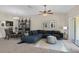 Spacious living room with sectional sofa and dining area at 13640 Eastfork Ln, Hudson, FL 34669