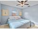 Serene bedroom with light blue walls and king-size bed at 1480 N Russell Dr, St Petersburg, FL 33710