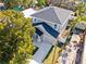 Aerial view of a two-story house with a gray roof and driveway at 1815 E 22Nd Ave, Tampa, FL 33605
