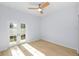 Bright bedroom with hardwood floors and french doors to the backyard at 1815 E 22Nd Ave, Tampa, FL 33605