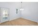Dining room with hardwood floors, light walls, and a view to the front door at 1815 E 22Nd Ave, Tampa, FL 33605