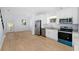 Bright kitchen featuring stainless steel appliances and light wood flooring at 1815 E 22Nd Ave, Tampa, FL 33605