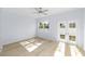 Light and airy living room with hardwood floors and french doors leading to backyard at 1815 E 22Nd Ave, Tampa, FL 33605