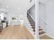 Modern staircase with black metal railing in a light-colored home at 1815 E 22Nd Ave, Tampa, FL 33605