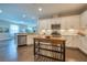 Modern kitchen with white cabinets, granite countertops, and stainless steel appliances at 2004 Sidney St, Clearwater, FL 33763