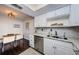 Clean kitchen featuring white cabinets, granite counters, and stainless steel appliances at 2739 Sherbrooke Ln # B, Palm Harbor, FL 34684