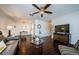 Living room with dark hardwood floors, TV, and sofa at 2739 Sherbrooke Ln # B, Palm Harbor, FL 34684