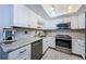Updated kitchen with stainless steel appliances and white cabinets at 2739 Sherbrooke Ln # B, Palm Harbor, FL 34684