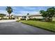 House exterior showcasing landscaping and driveway at 2739 Sherbrooke Ln # B, Palm Harbor, FL 34684