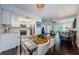 Eat-in kitchen with stainless steel appliances and white cabinets at 2739 Sherbrooke Ln # B, Palm Harbor, FL 34684