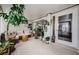 Sunroom features tiled floor and comfy seating area at 2739 Sherbrooke Ln # B, Palm Harbor, FL 34684