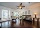 Bright living room with dark hardwood floors, comfy seating, and a view to the kitchen at 2739 Sherbrooke Ln # B, Palm Harbor, FL 34684