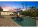 Inviting pool and patio area at dusk at 3108 S Maritana Dr, St Pete Beach, FL 33706